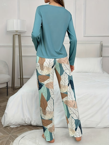 Conjunto de pijama casual, versátil e elegante para mulher com estampado de letras, blusa de manga comprida com gola redonda e calças com estampado floral para o outono e inverno.