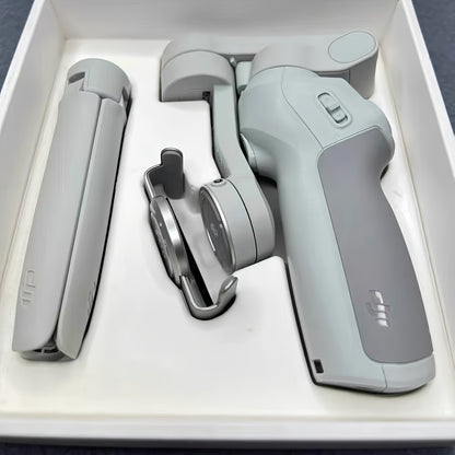 DJI Osmo Mobile SE OM Handheld Gimbal Stabilizer, a portable, foldable, intelligent follow - shooting and anti - shake mobile phone selfie gadget that is compatible with various devices