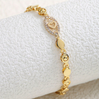 Elegant 18K Golden Plated Copper Bracelet with Synthetic Cubic Zirconia, Heart and Leaf Motif Openwork Design for Daily Wear and Special Occasions