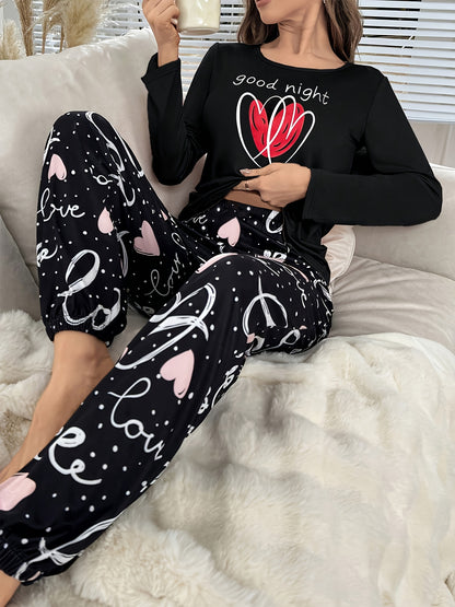 Conjunto de pijama para menina para o outono e inverno com mangas compridas, calças e estampado fofo de corações com letras em estilo cartoon. Ideal para relaxar em casa em todas as estações.