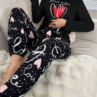 Conjunto de pijama para menina para o outono e inverno com mangas compridas, calças e estampado fofo de corações com letras em estilo cartoon. Ideal para relaxar em casa em todas as estações.