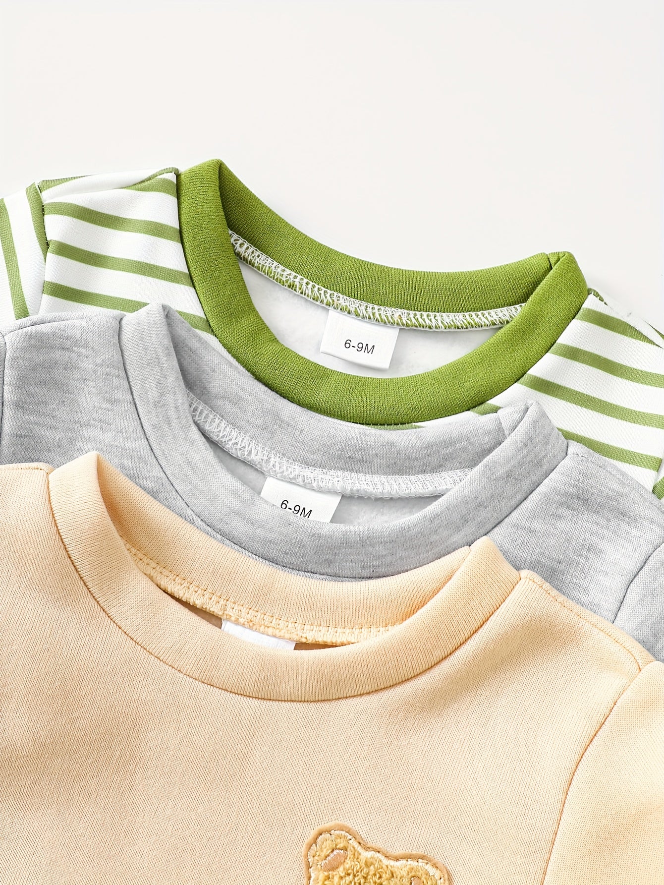 A Set of Three Fleece Hoodies for Baby Boys, Packaged in Six Pieces, Featuring a Cute Bear Patch. Perfect for Outdoor Wear During The Autumn And Winter Seasons, Making It a Great Gift for Children.