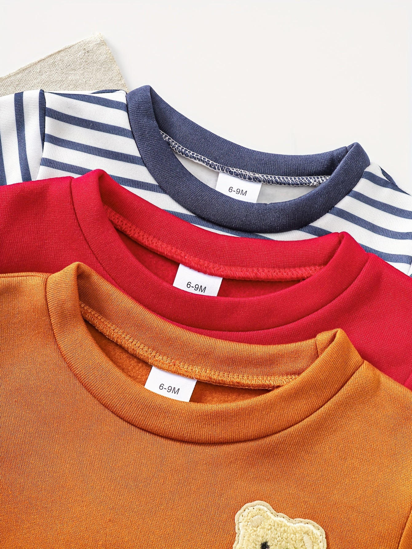 A Set of Three Fleece Hoodies for Baby Boys, Packaged in Six Pieces, Featuring a Cute Bear Patch. Perfect for Outdoor Wear During The Autumn And Winter Seasons, Making It a Great Gift for Children.