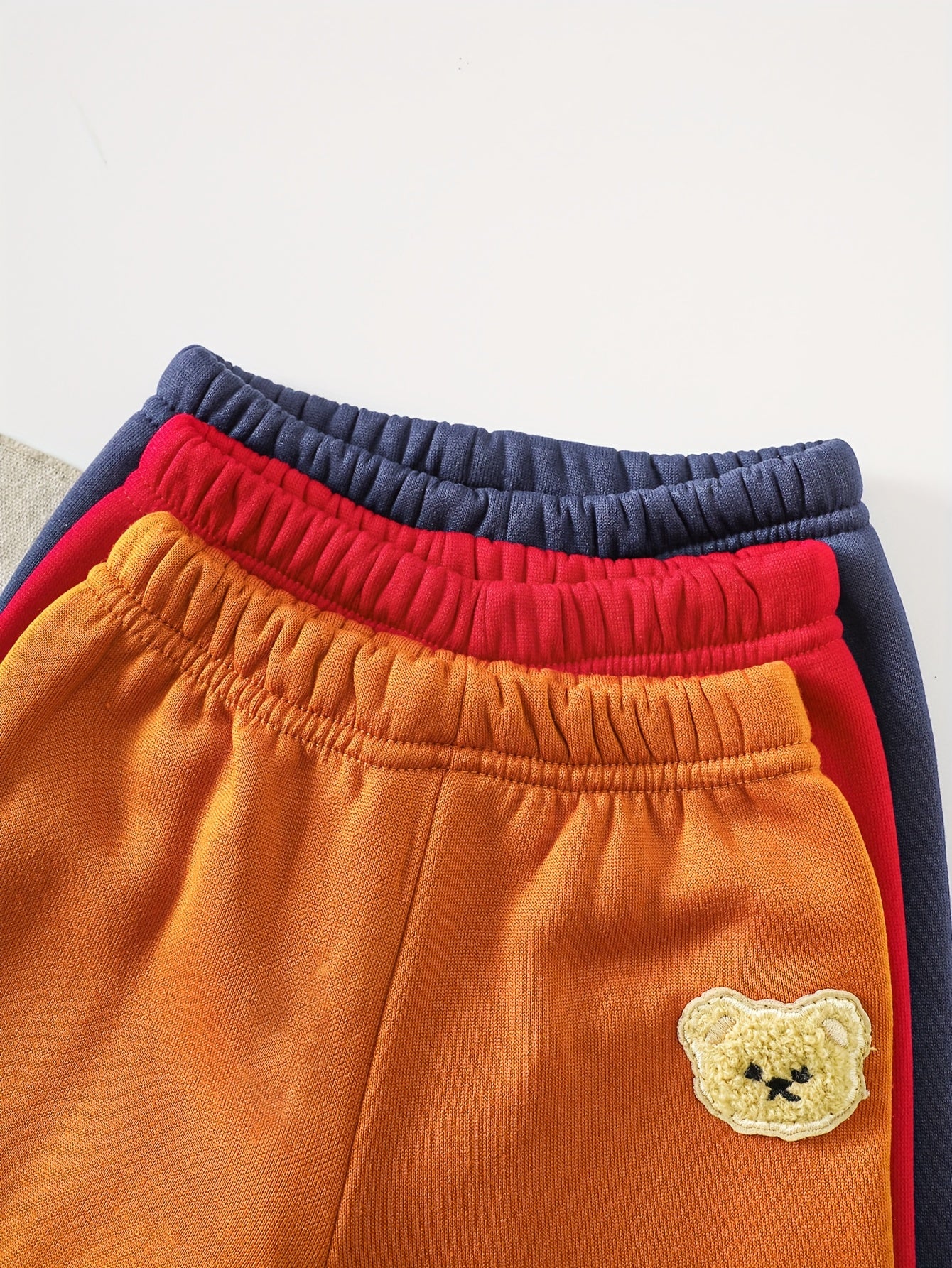 A Set of Three Fleece Hoodies for Baby Boys, Packaged in Six Pieces, Featuring a Cute Bear Patch. Perfect for Outdoor Wear During The Autumn And Winter Seasons, Making It a Great Gift for Children.